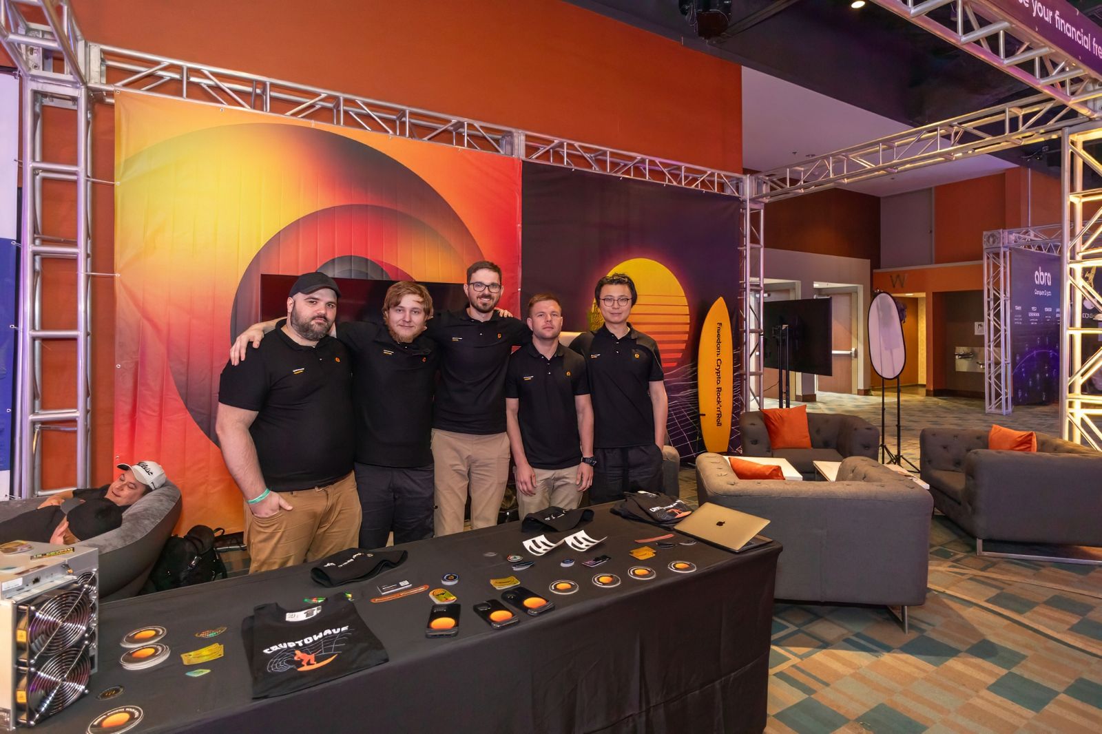 Exhibitor team posing at their booth