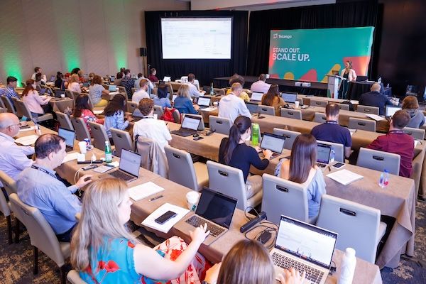 Full classroom-style session with attendees at laptops