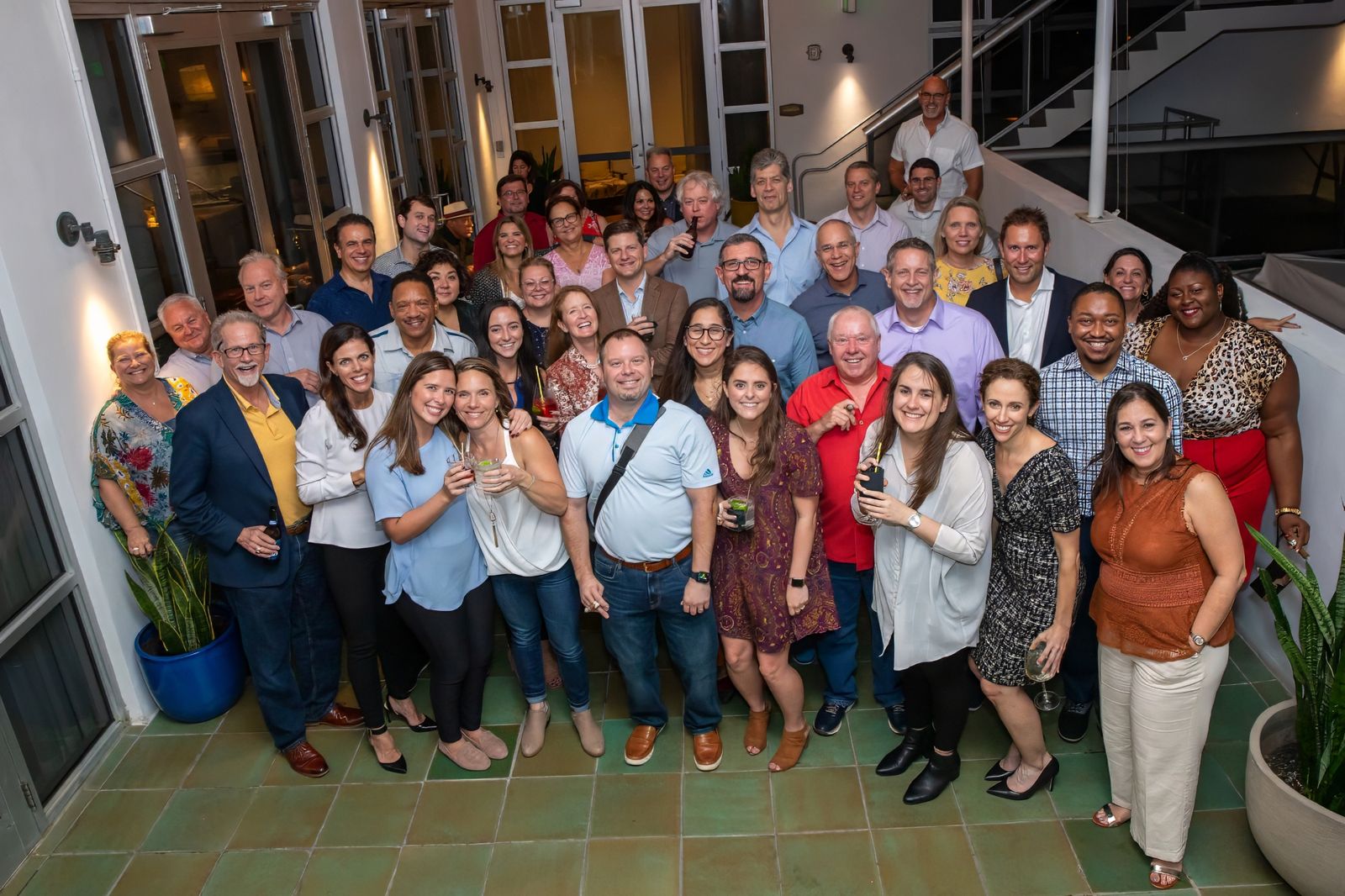 Group photo of attendees in a lobby