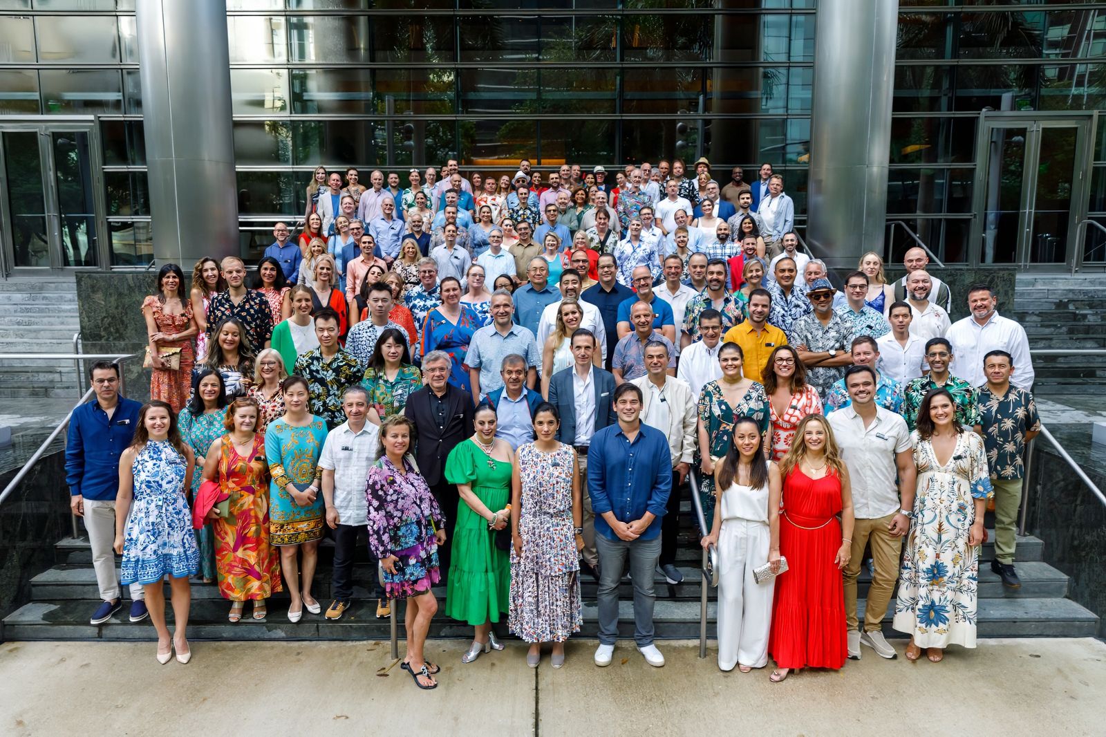 Large company group photo on outdoor steps