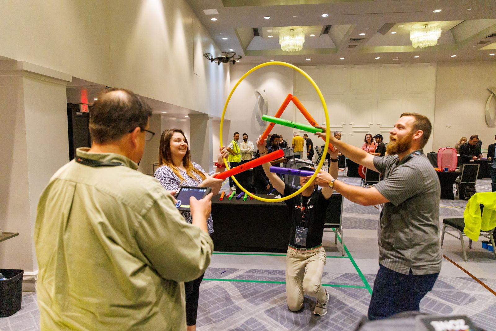 Attendees playing a team hoop game during a sales kickoff